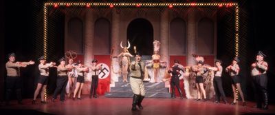 Roger Debris (Kevin Murphy) as 'The Singing Dancing Hitler' with the cast of  Photo