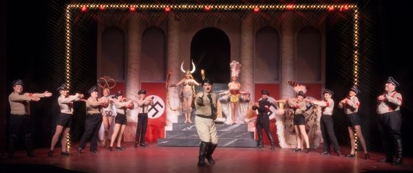 Roger Debris (Kevin Murphy) as 'The Singing Dancing Hitler' with the cast of  Photo