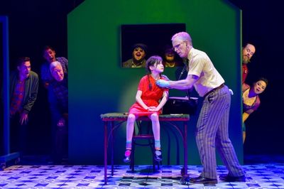 Savvy Crawford as young Amelie and John Hickok as Raphael with the cast of AMELIE Photo