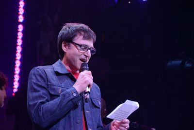 Stephen Trask reading a note from John Cameron Mitchell Photo