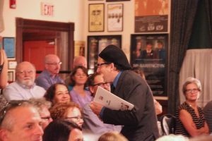 Dana Packard collies words from members of the sold out audience. Photo