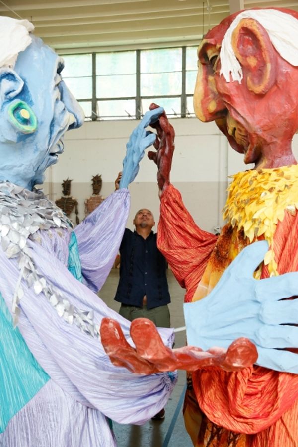  Kinan Valdez works with the Grandmother and Grandfather puppets Photo
