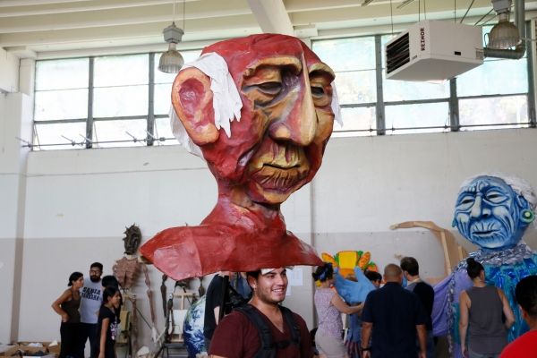 Damien Medel mans the head of the Grandfather puppet Photo