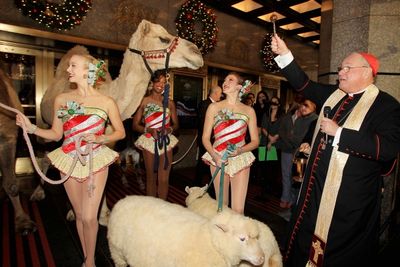 Timothy Cardnal Dolan and The Rockettes Photo