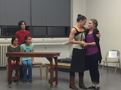 Laura Frye as Mrs. Cratchit and Melissa Joiner as Martha Cratchit with Quinn Theobald Photo