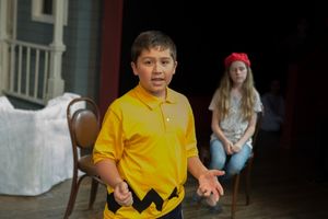 Charlie Brown (Seth Winnick) deposits a nickel into Lucy''s (Samantha Koegler) money jar as he seeks advice. @ BroadwayWorld Charlie Brown (Seth Winnick) deposits a nickel into Lucy''s (Samantha Koegler) money Photo