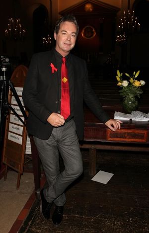 LONDON, ENGLAND - NOVEMBER 25:  Julian Clary attends ''A Source of Life: 25 Years of  Photo