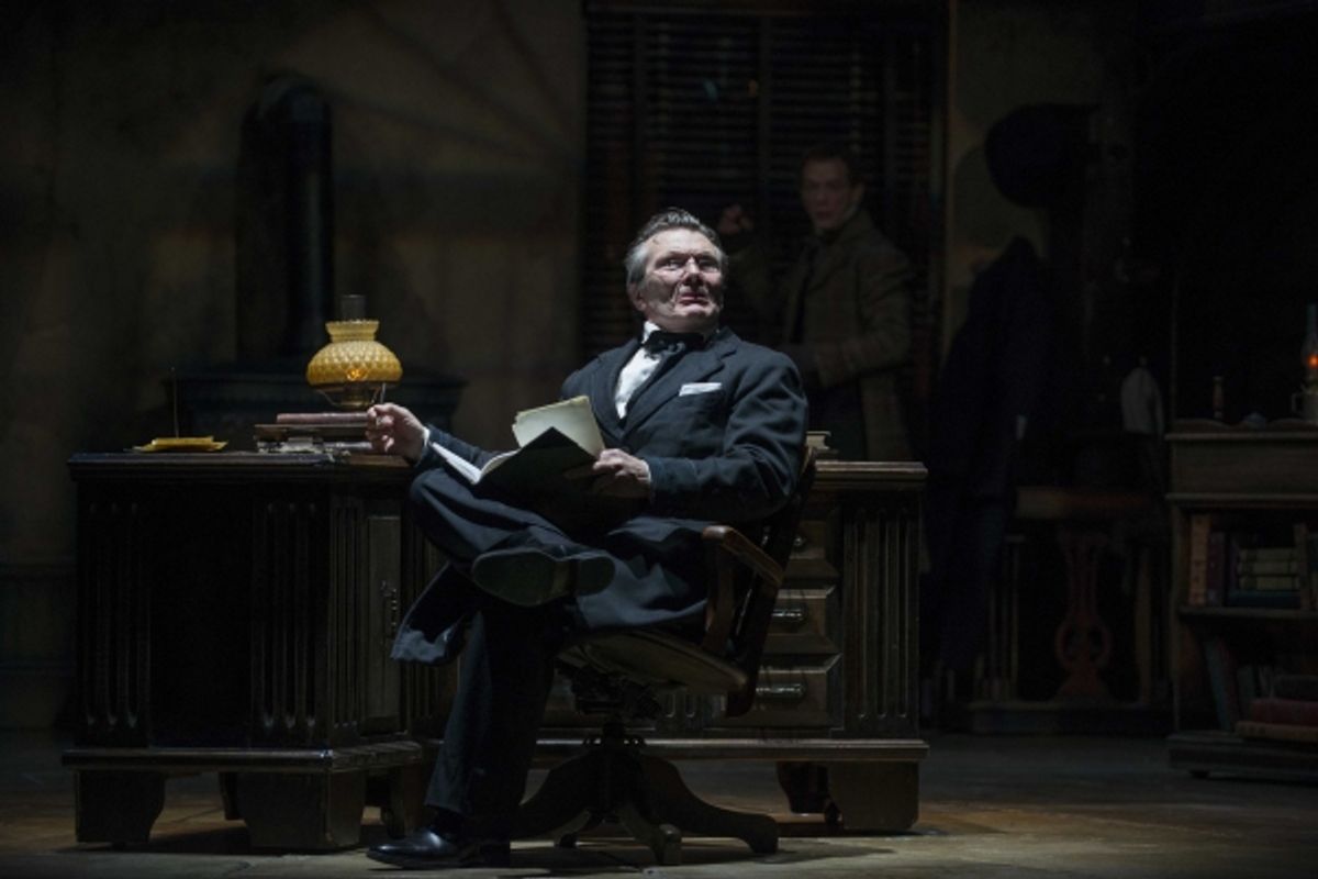 Jonathan Smoots as Ebenezer Scrooge and Jonathan Wainwright (background) as Bob Cratchit at 