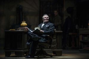 Jonathan Smoots as Ebenezer Scrooge and Jonathan Wainwright (background) as Bob Cratc Photo