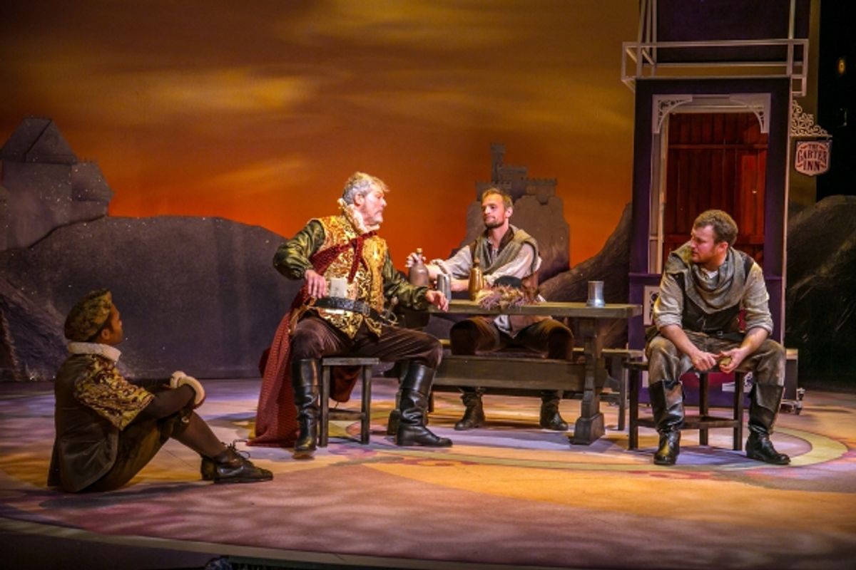Sir John Falstaff plots with his compatriots Robin (Felix Mayes), Pistol (Jason Paul Tate), and Nym (Ryan McCarthy)  at 