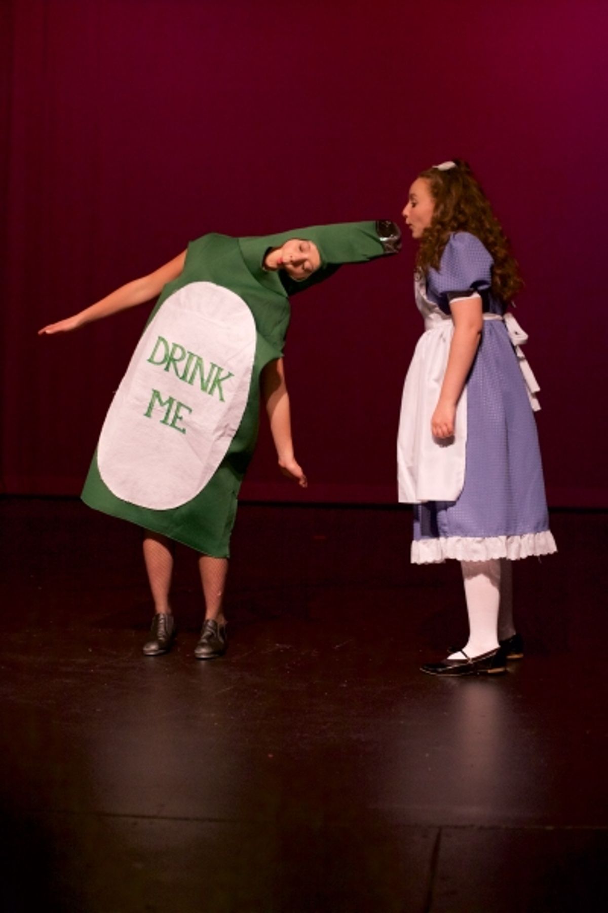 Talia Hankin as ''Drink Me'' and Nicole Kalitsas as Alice at 