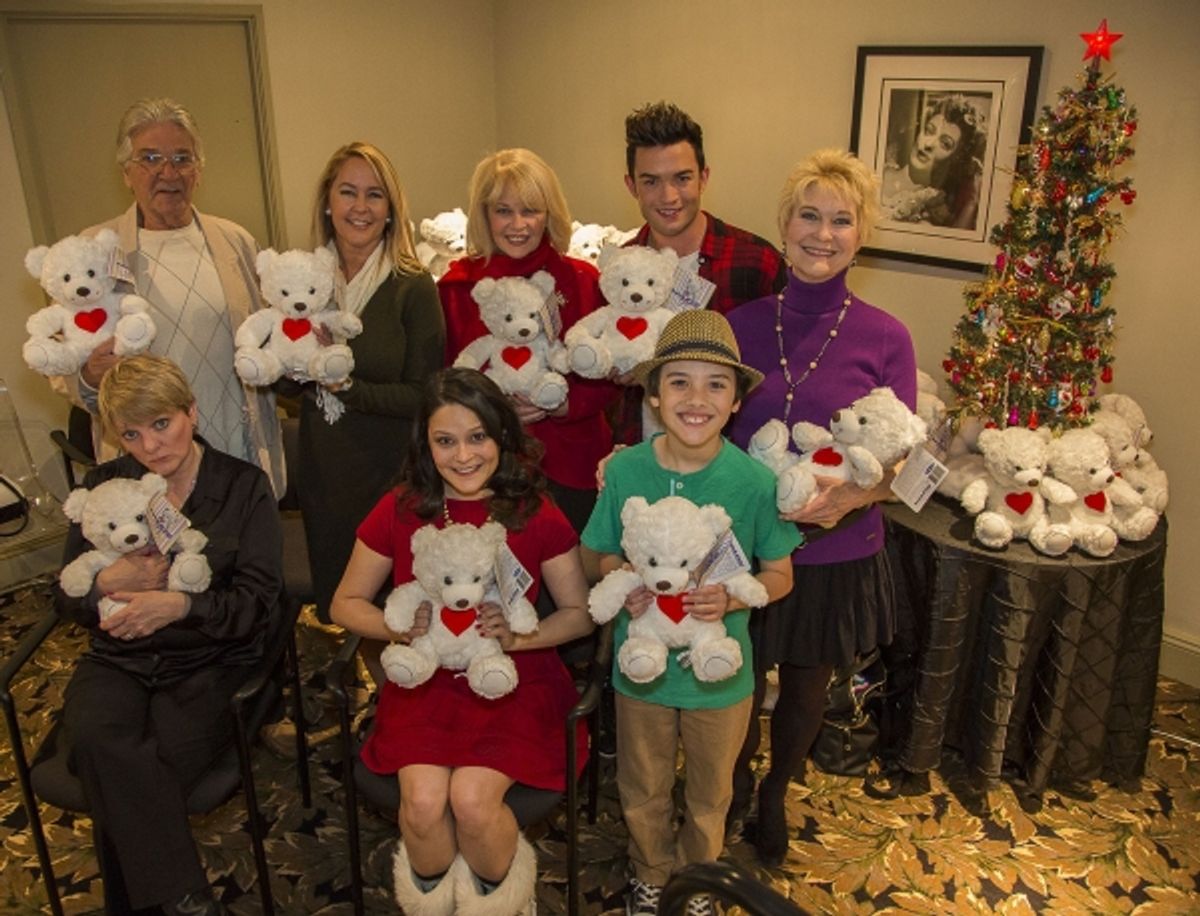 Alison Arngrim, Paul Petersen, Erin Murphy, Romi Dames, Ilene Graff, Chris Trousdale, Hunter Payten and Dee Wallace display the BuppalaPaloo Bears to be handed out to students at 