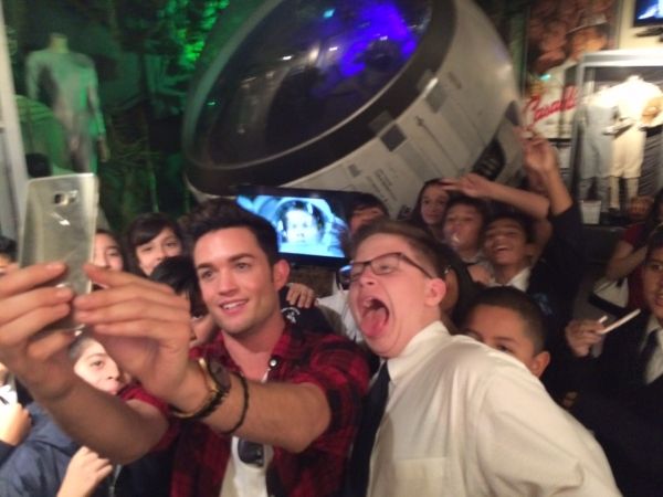 Chris Trousdale takes selfies with students of Dolores Mission School Photo