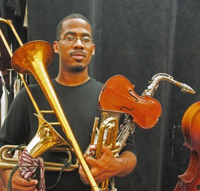 Composer James Brandon Lewis and puppets. Photo