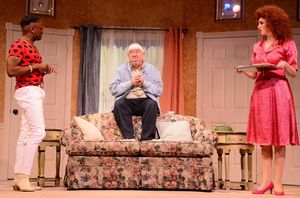 Bobby Franklyn (Sean Blake), left, asks John Smith (Eddie Curry), center, if he''s in Photo