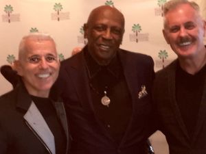 producers Michael Anastasio and Richard Eric Weigle with Oscar-winning actor Louis Go Photo