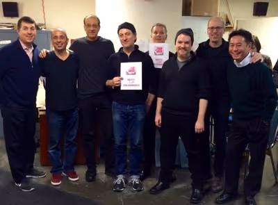 /James Walski, producer Makoto Deguchi, and the TRIP OF LOVE band celebrate the 100th Photo