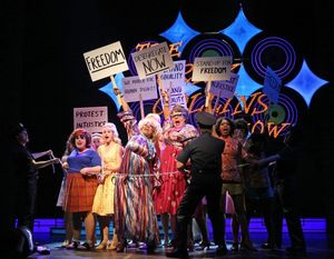 (behind chain, front, from left) Amelia Jo Parish plays Tracy Turnblad, Samantha Paul Photo