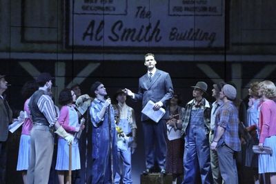 Kevin Earley (center) and the company Photo