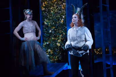 Puck (Erin Weaver, left) looks upon the newly transformed Bottom (Holly Twyford) with Photo