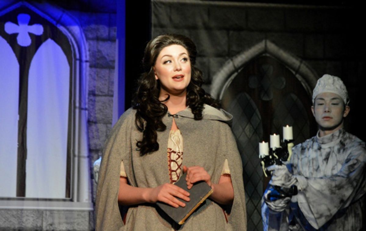 Beauty (Kaitlyn Baldwin) explores the Beast's castle at 