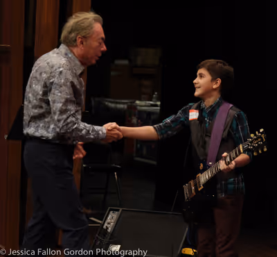 Andrew Lloyd Webber speaks with a School of Rock auditionee Photo
