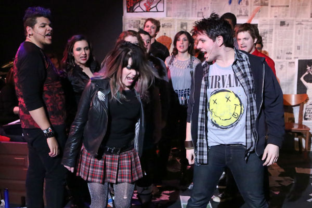 (front) Sarah Porter as Whatsername and Evan Fornachon as Johnny with the cast of New Line Theatre's AMERICAN IDIOT at 