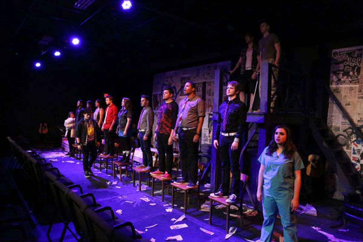 Evan Fornachon as Johnny (in front) with the cast of New Line Theatre's AMERICAN IDIOT at 
