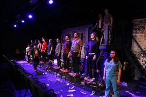 Evan Fornachon as Johnny (in front) with the cast of New Line Theatre's AMERICAN IDIO Photo