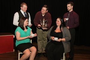 Brassett (Richard Foster) serving at Amy Spettigue's (Eileen Daub) house, along with  Photo