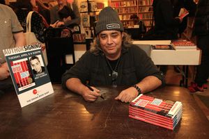 Pulitzer prize-winning playwright Stephen Adly Guirgis signing copies of his plays at Photo