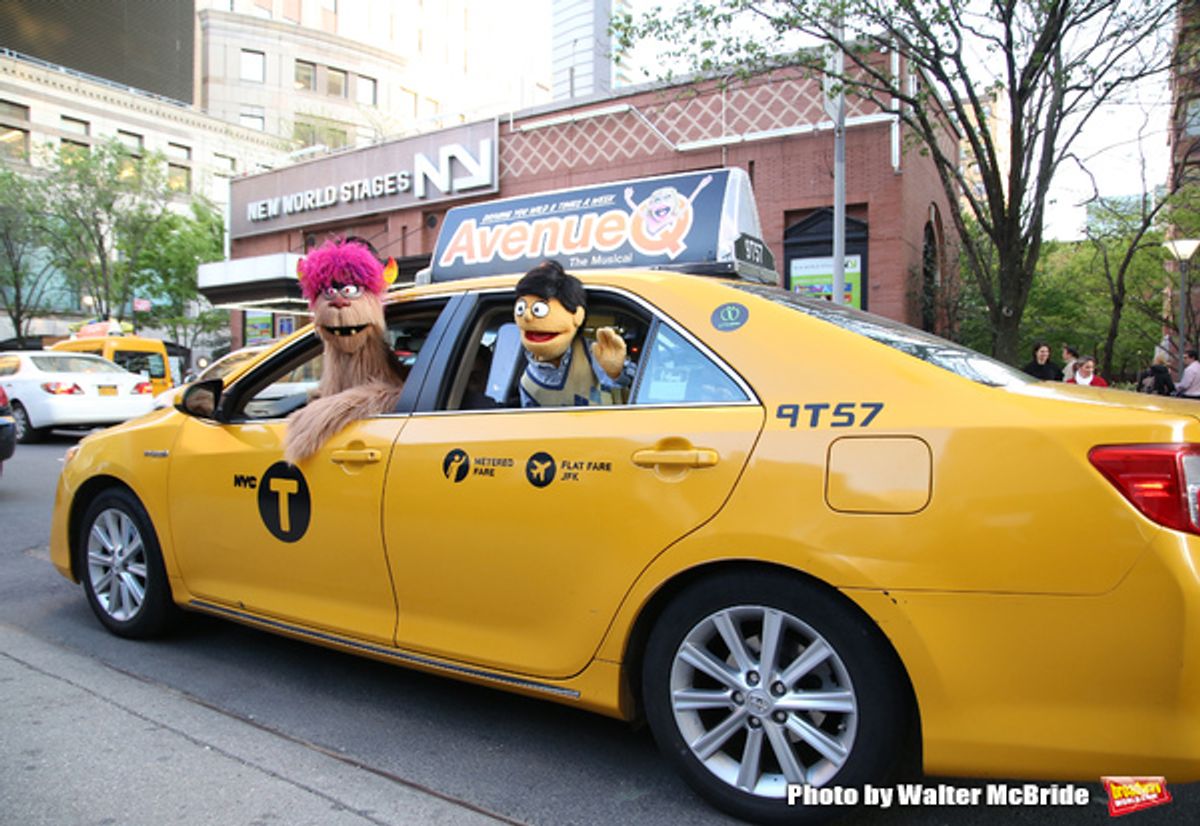   Trekkie Monster drives a New York City 'Avenue Q'  Taxi with Princeton as his passenger at 