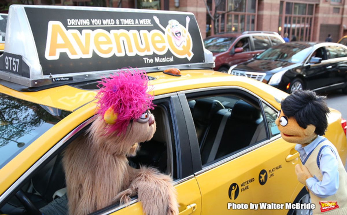   Trekkie Monster drives a New York City 'Avenue Q'  Taxi with Princeton as his passenger at 
