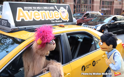   Trekkie Monster drives a New York City 'Avenue Q'  Taxi with Princeton as his passe Photo