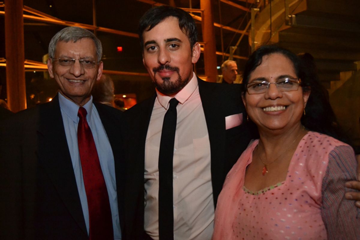 Nehal Joshi (center) with his parents at 