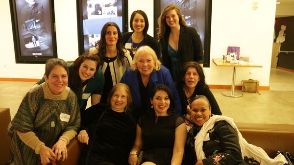 Hardworking staff and volunteers relax at the end of a long night. Photo by Lizzy Bry Photo