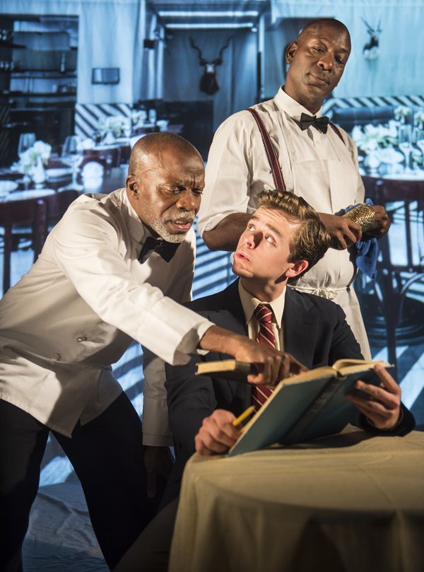 Sam (L. Peter Callender) does homework with Hally (Andrew Humann) as Wille (Adrian Ro Photo