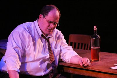 Zachary Allen Farmer as Leo Szilard, singing "Where is Home?", in New Line Theatre's  Photo