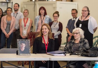 Rachel York and Betty Buckley with a photo of absent cast member Bryan Batt  Photo