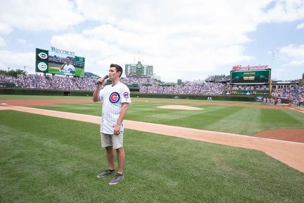 Ryan Bondy (Elder Price) sings the National Anthem Photo