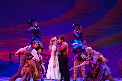 Laurey (Anne Horak) finds it difficult to resist Jud (Victor J. Wisehart) in her drea Photo