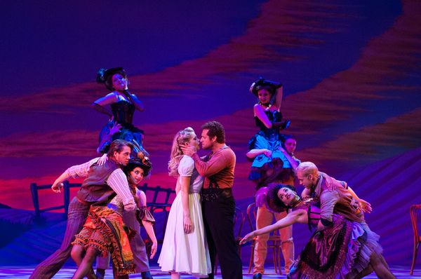 Laurey (Anne Horak) finds it difficult to resist Jud (Victor J. Wisehart) in her drea Photo