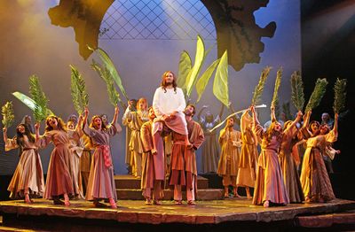 The company of JESUS CHRIST SUPERSTAR sings 'Hosanna' to Jesus (Thaddeus Pearson). Photo