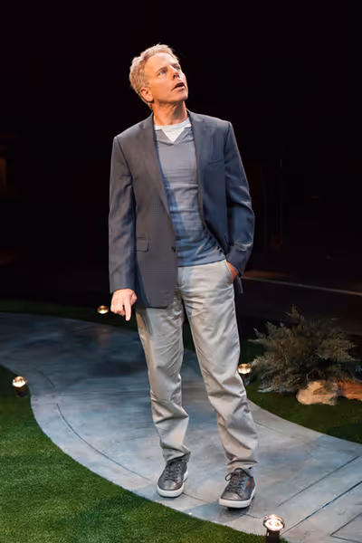 Greg Germann appears as Norm Photo