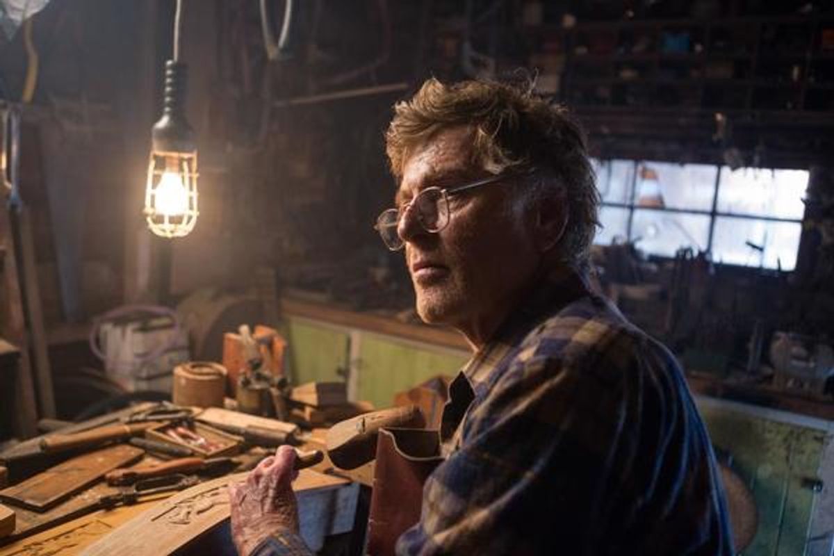 Robert Redford is Mr. Meacham, an old wood carver who is fond of telling tales about big, furry green dragons in Disney's PETE'S DRAGON, the story of a boy named Pete and his best friend Elliot, who just happens to be a dragon. at 