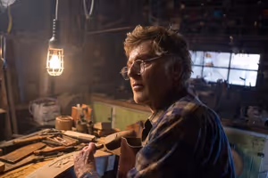 Robert Redford is Mr. Meacham, an old wood carver who is fond of telling tales about big, furry green dragons in Disney's PETE'S DRAGON, the story of a boy named Pete and his best friend Elliot, who just happens to be a dragon. @ BroadwayWorld Robert Redford is Mr. Meacham, an old wood carver who is fond of telling tales about Photo