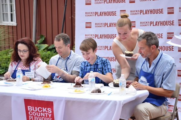 Abby Langsted, Bucks County Playhouse Marketing Manager (standing), brings cupcakes t Photo