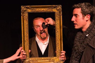 (L to R) KAYLA CRAWFORD'S HAND (Dr. Watson), GARY CHAMBERS (as a a Baskerville as Sta Photo