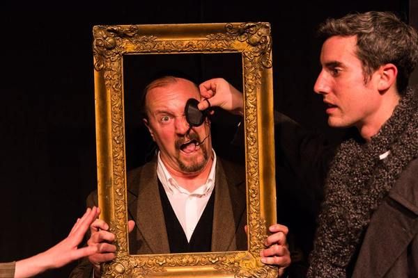 (L to R) KAYLA CRAWFORD'S HAND (Dr. Watson), GARY CHAMBERS (as a a Baskerville as Sta Photo