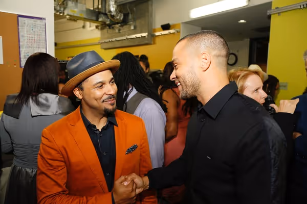 Cast member Jason Dirden and actor Jesse Williams Photo